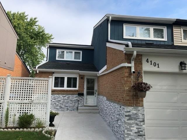 Dark stucco and stone reno in Oakville