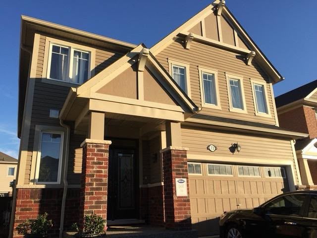 Stone and stucco craftsman home in Milton